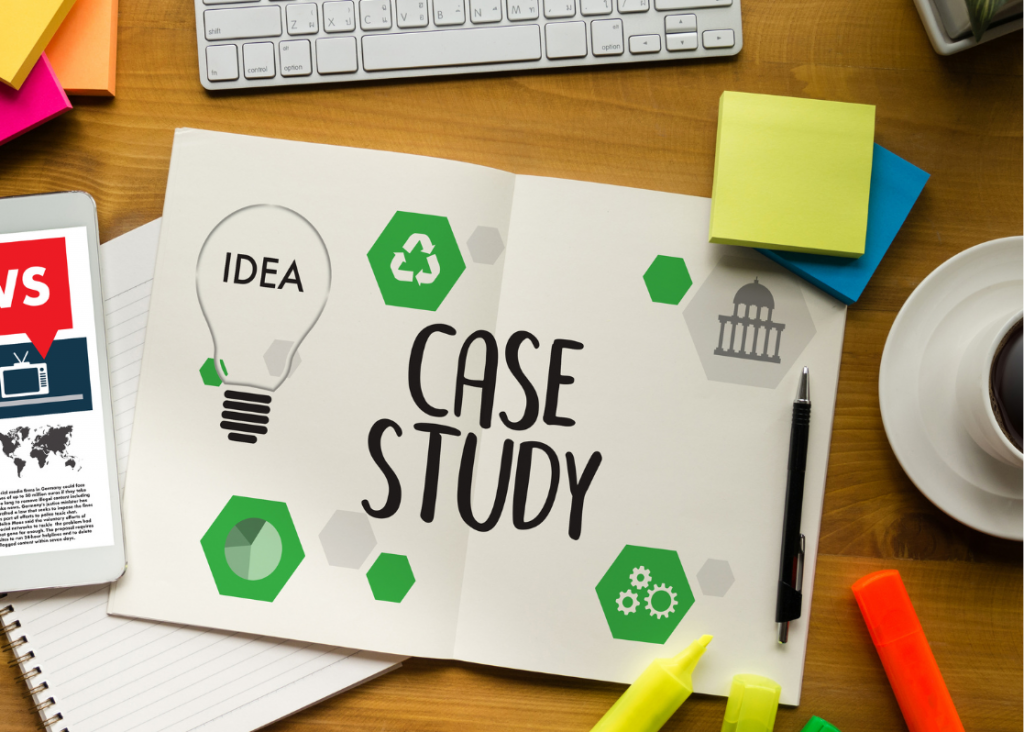 Piece of paper on a desk stating cae study, surrounding by colourful sticky notes and highlighter pens